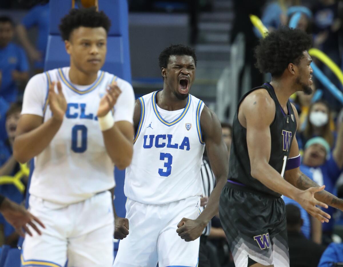 UCLA guard Jaylen Clark, left, and UCLA forward Adam Bona celebrate after defeating Washington on Thursday.