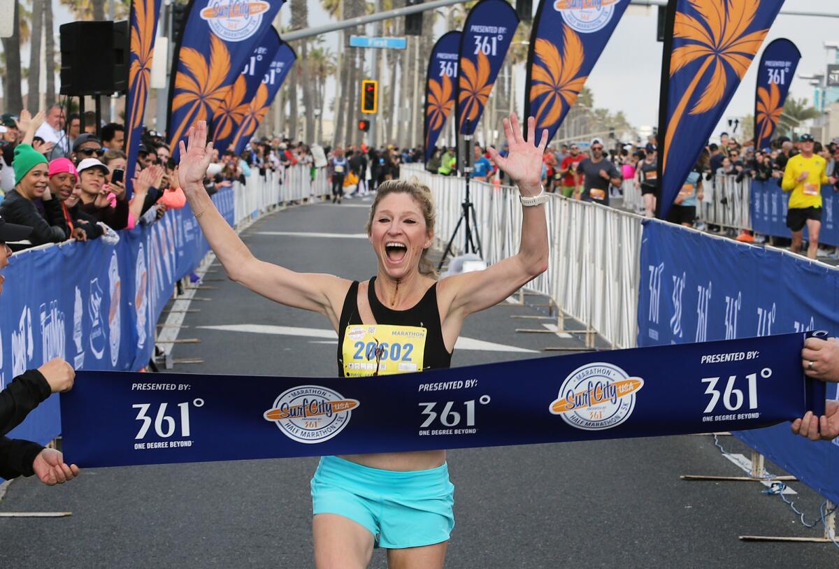 Michelle Jacobsen of Newport Beach wins the women’s Surf City Marathon in Huntington Beach on Sunday. 