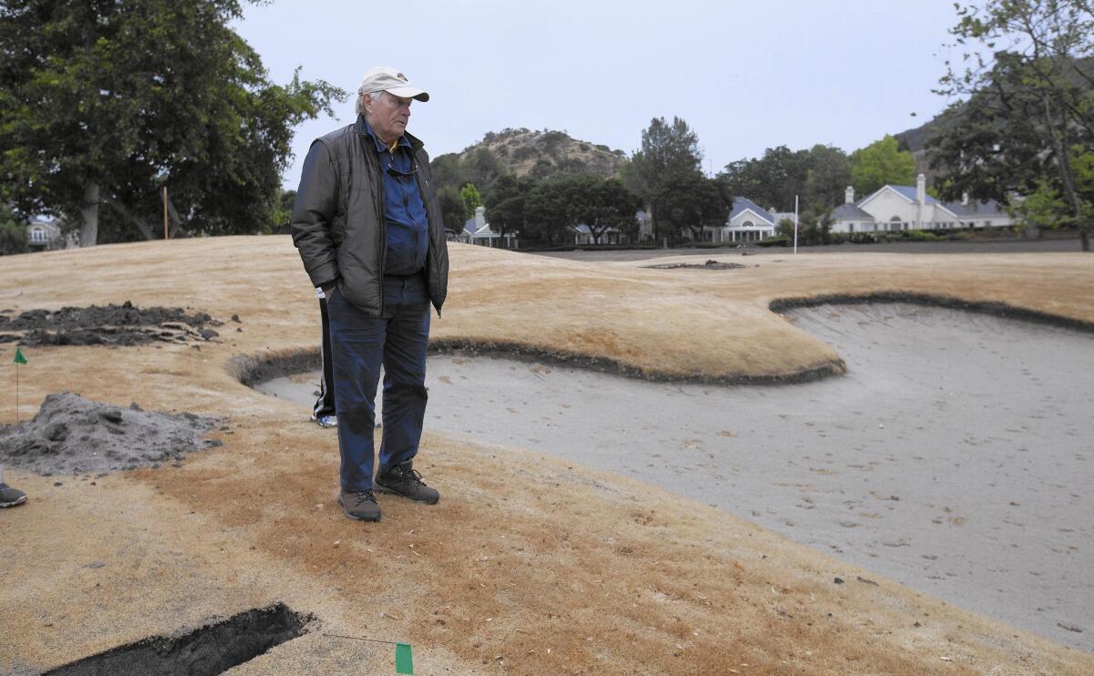 Golf legend and course designer Jack Nicklaus surveys a sand trap at Sherwood Country Club under renovation in Thousand Oaks.