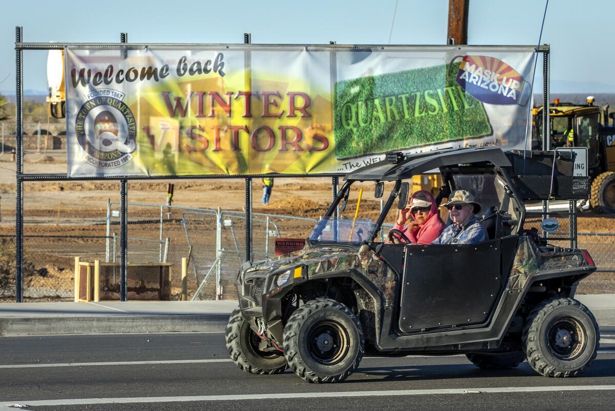 Snowbirds make their way along Main Street in Quartzsite, Ariz.