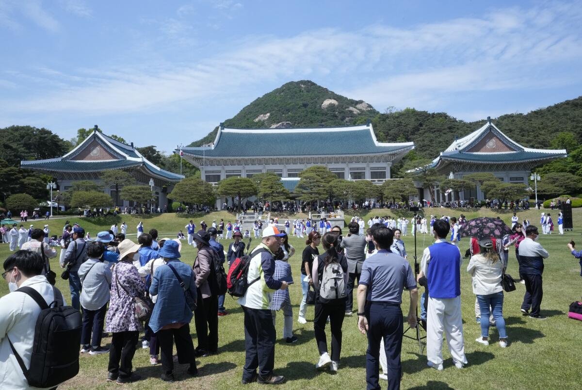 Visitors on the grounds of former South Korean presidential palace
