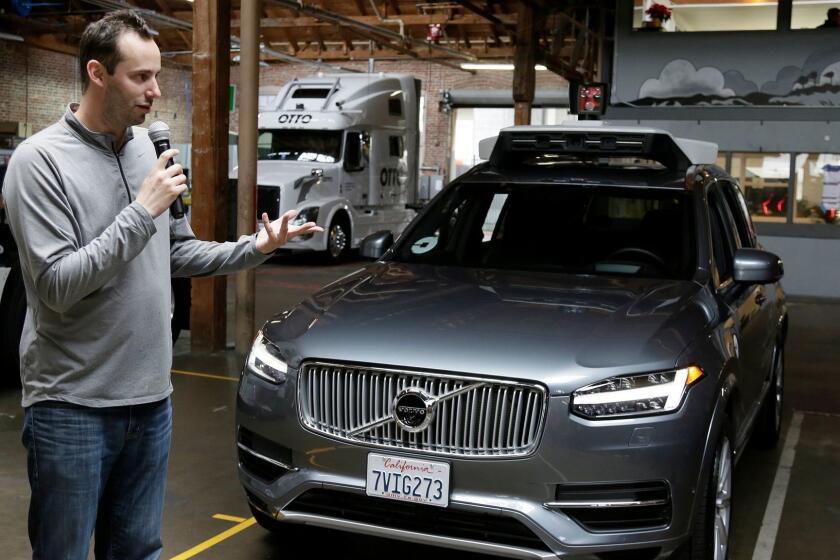 FILE- In this Dec. 13, 2016, file photo, Anthony Levandowski, head of Uber's self-driving program, speaks about their driverless car in San Francisco. In an order filed Monday, May 15, 2017, a federal judge ordered Uber to stop using technology that Levandowski downloaded before he left Waymo, the Alphabet Inc. autonomous car arm that was spun off from Google. The order filed Monday in a trade secrets theft lawsuit also forces Uber to return all downloaded materials. (AP Photo/Eric Risberg, File)