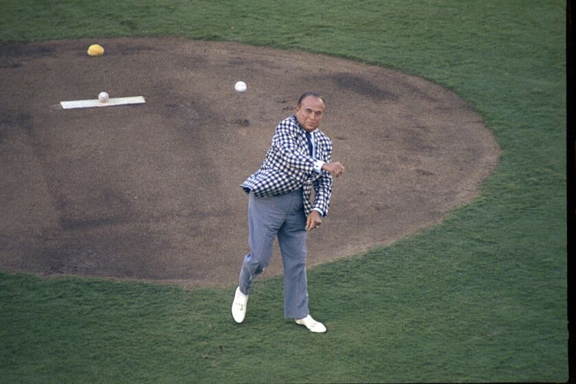 Padres owner Ray Kroc throws the ceremonial first pitch at the 49th All-Star baseball game on July 11, 1978, at San Diego Stadium.