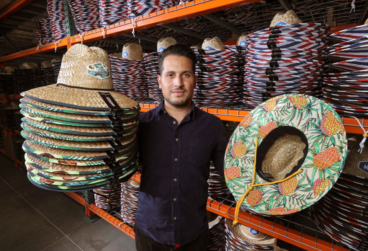 Anthony Lora, founder of the Hemlock Hat Co., at his company's Vista warehouse and headquarters.