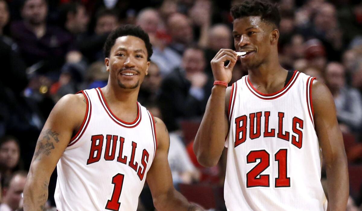 Jimmy Butler (21) and the Bulls will try to hold their playoff position until the hopeful return of point guard Derrick Rose.