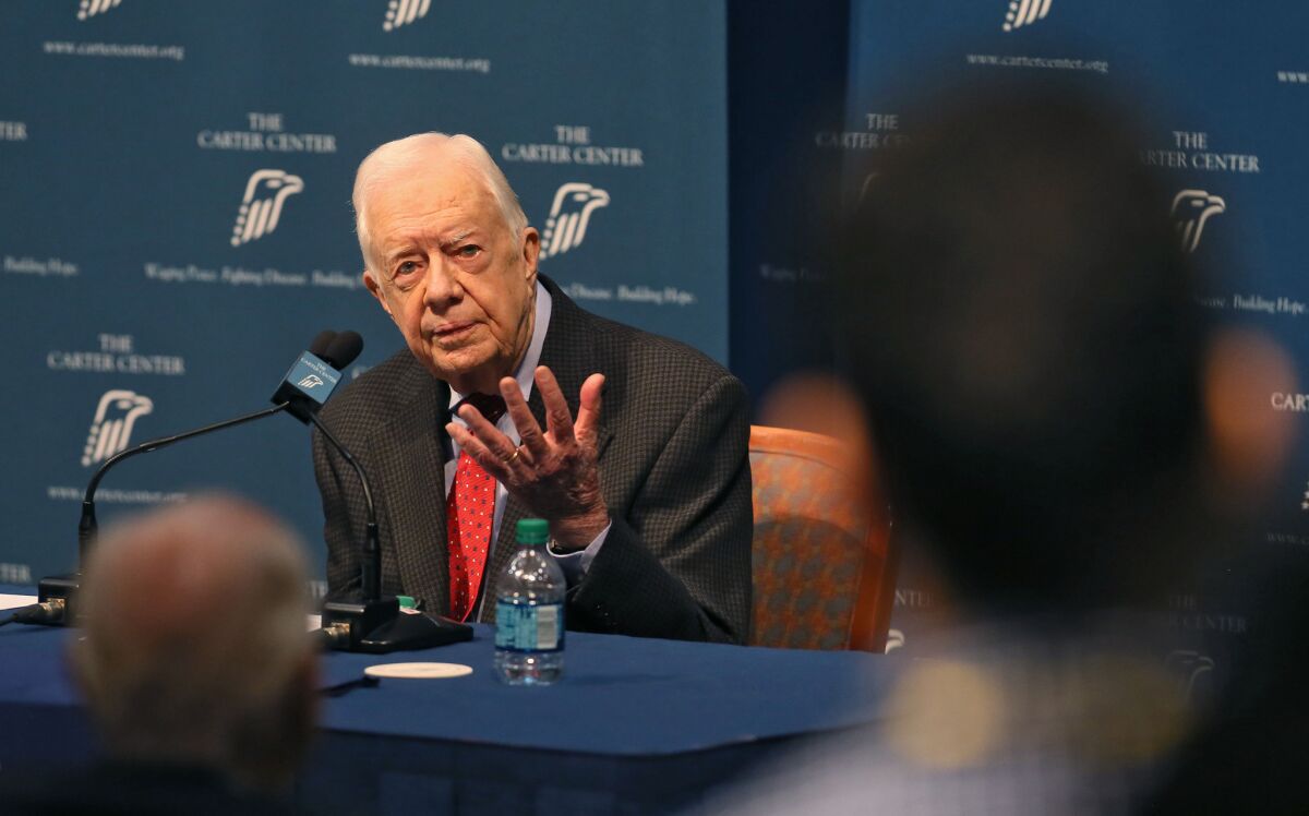 Former President Jimmy Carter discusses his cancer diagnosis at the Carter Center in Atlanta.