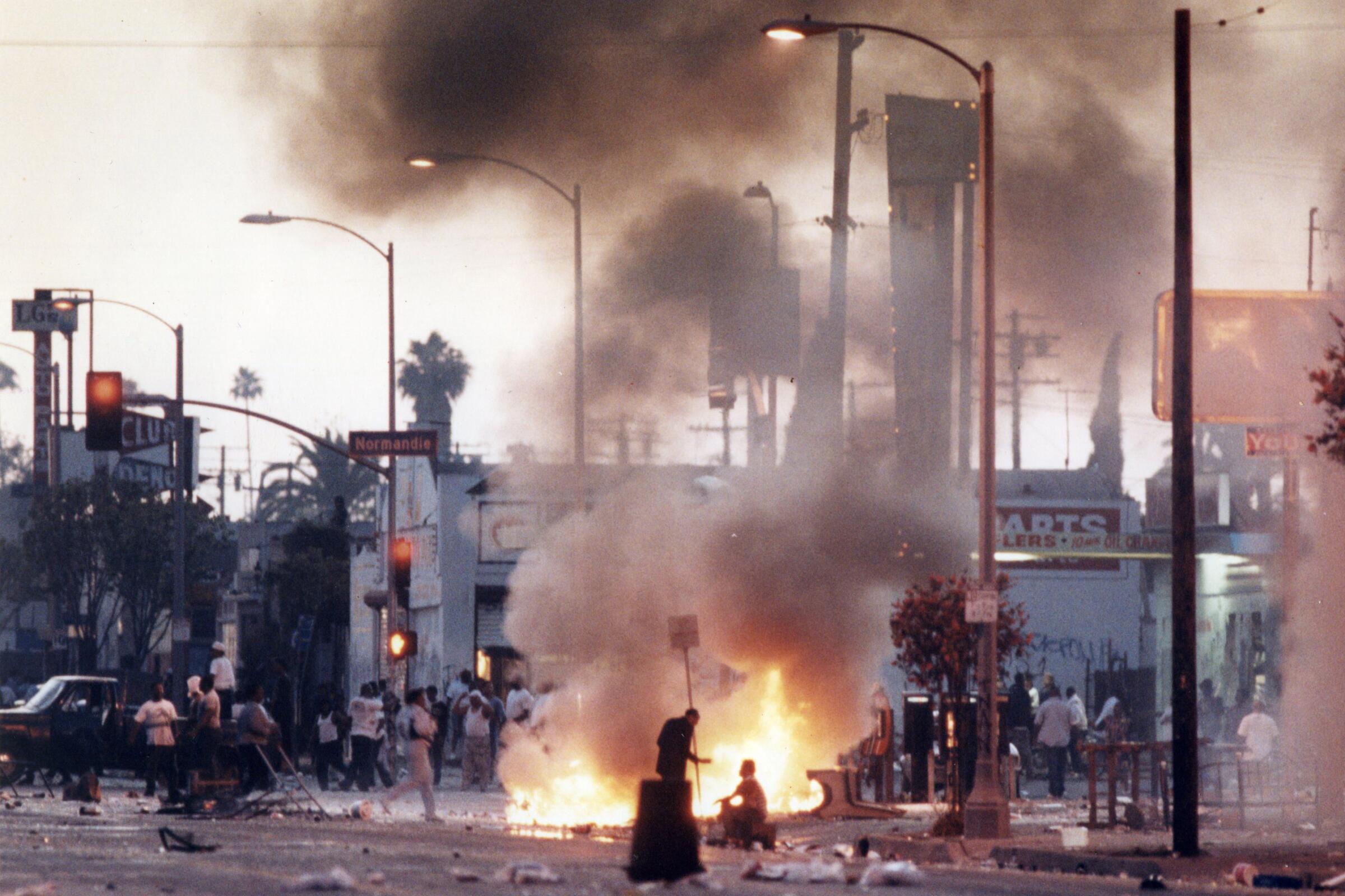 A fire burns on a corner during the first day the L.A. riots on April 29, 1992.
