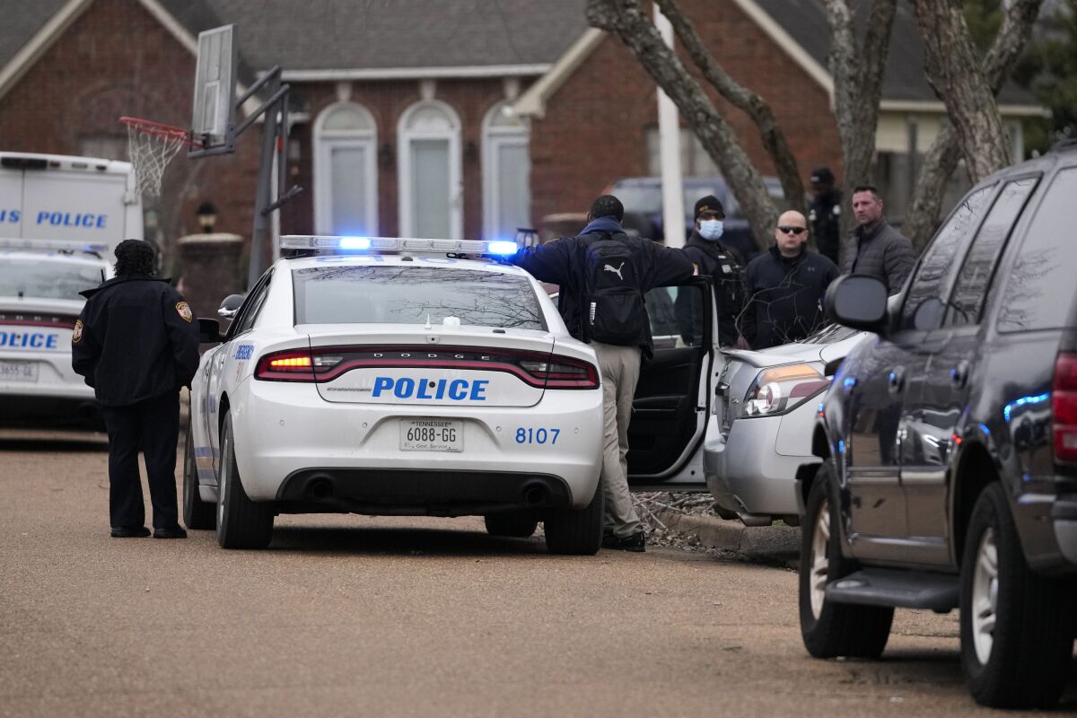 Members of the Memphis Police Department work a crime scene in Memphis, Tenn.