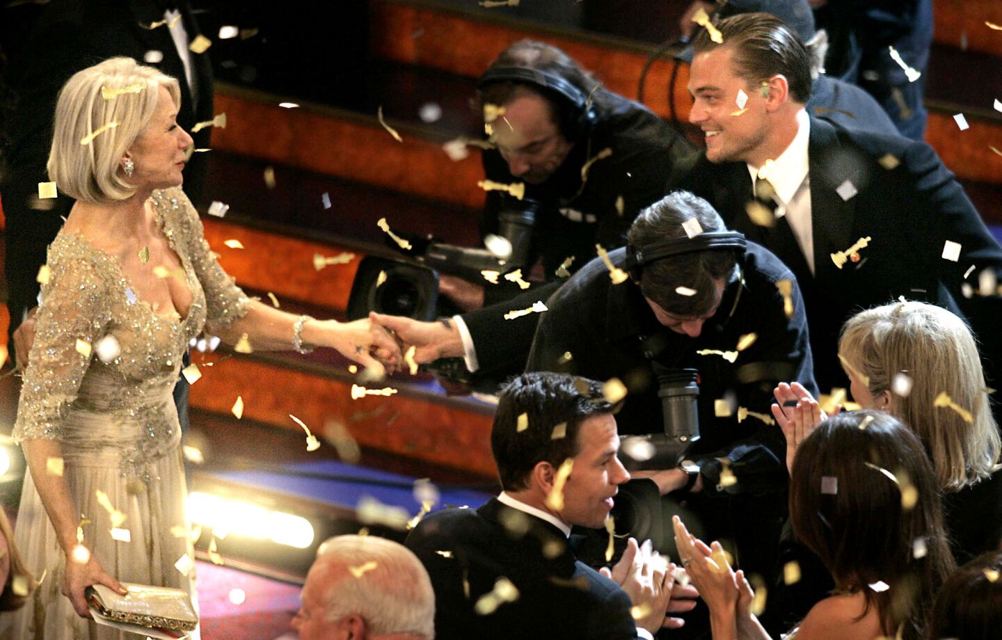 Leonardo DiCaprio congratulates Helen Mirren at the 79th Academy Awards.