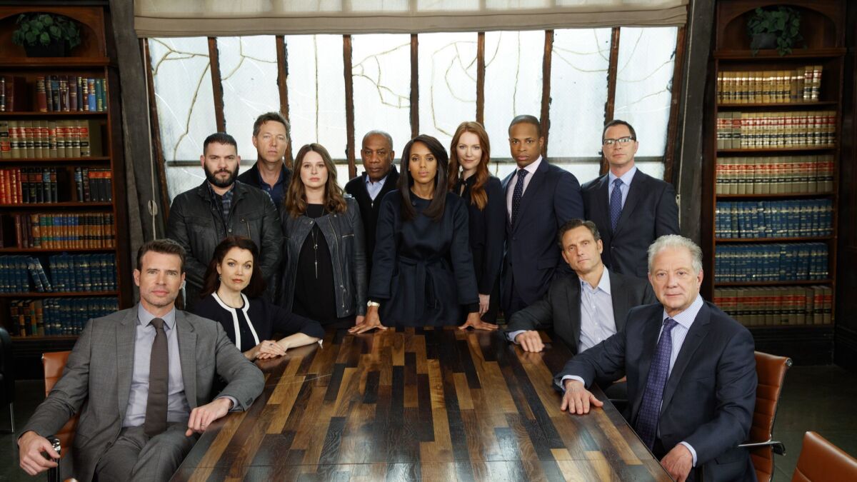 The cast of ABC's "Scandal," led by Kerry Washington, center, pose for a cast portrait during the final week of filming their series, on the Olivia Pope & Associates set, at the Sunset Gower Studios in Hollywood.