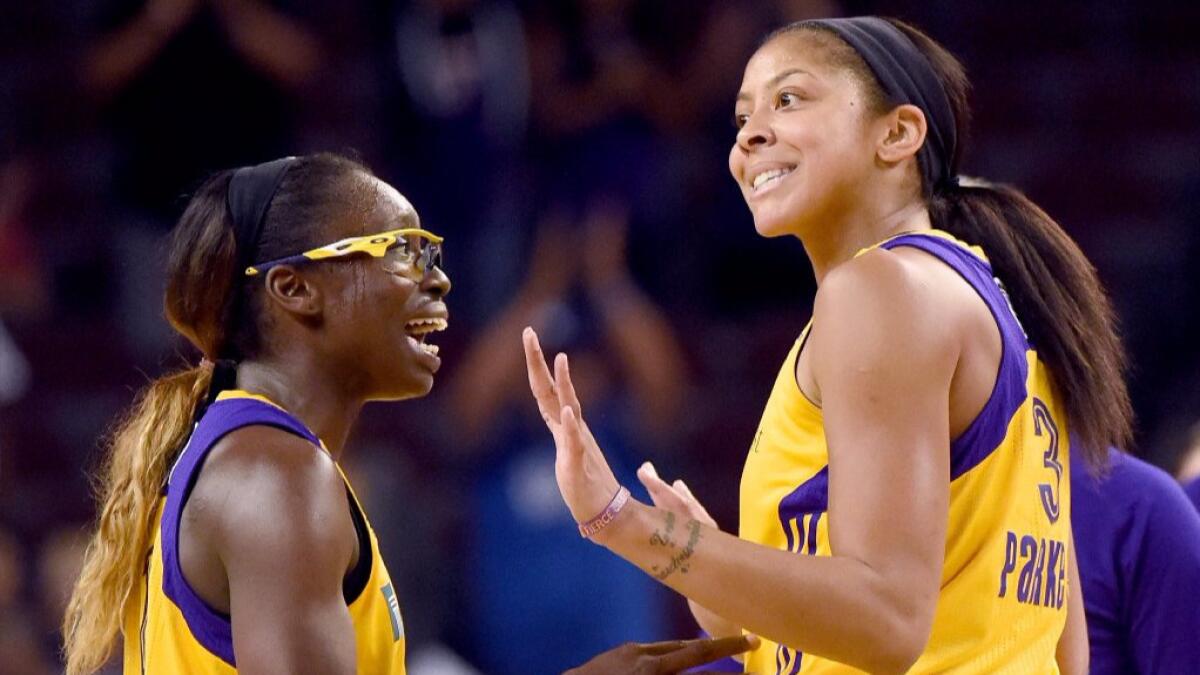 Candace Parker and Essence Carson react during a timeout in Game 3 of the WNBA Finals on Oct. 14.