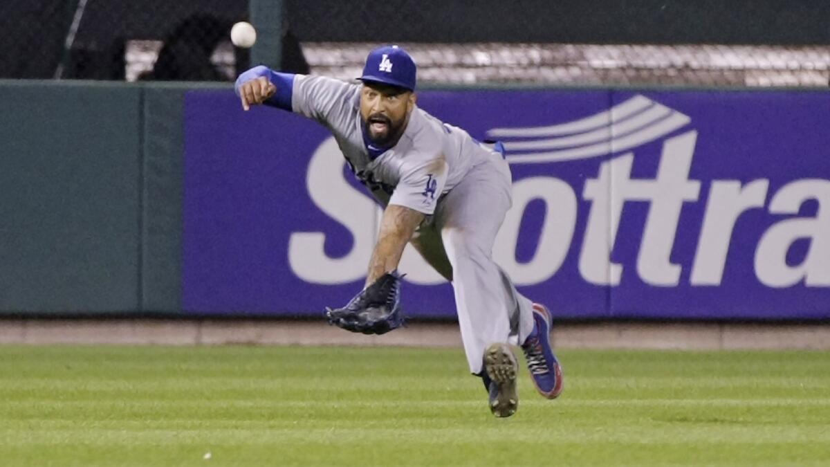 Dodgers center fielder Matt Kemp makes a diving catch in the sixth inning of the team's 4-3 win over the St. Louis Cardinals on Sunday night.