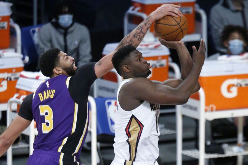 LOS ANGELES, CA - JANUARY 15: Zion Williamson (1), of the Pelicans, has his shot blocked by Anthony Davis.