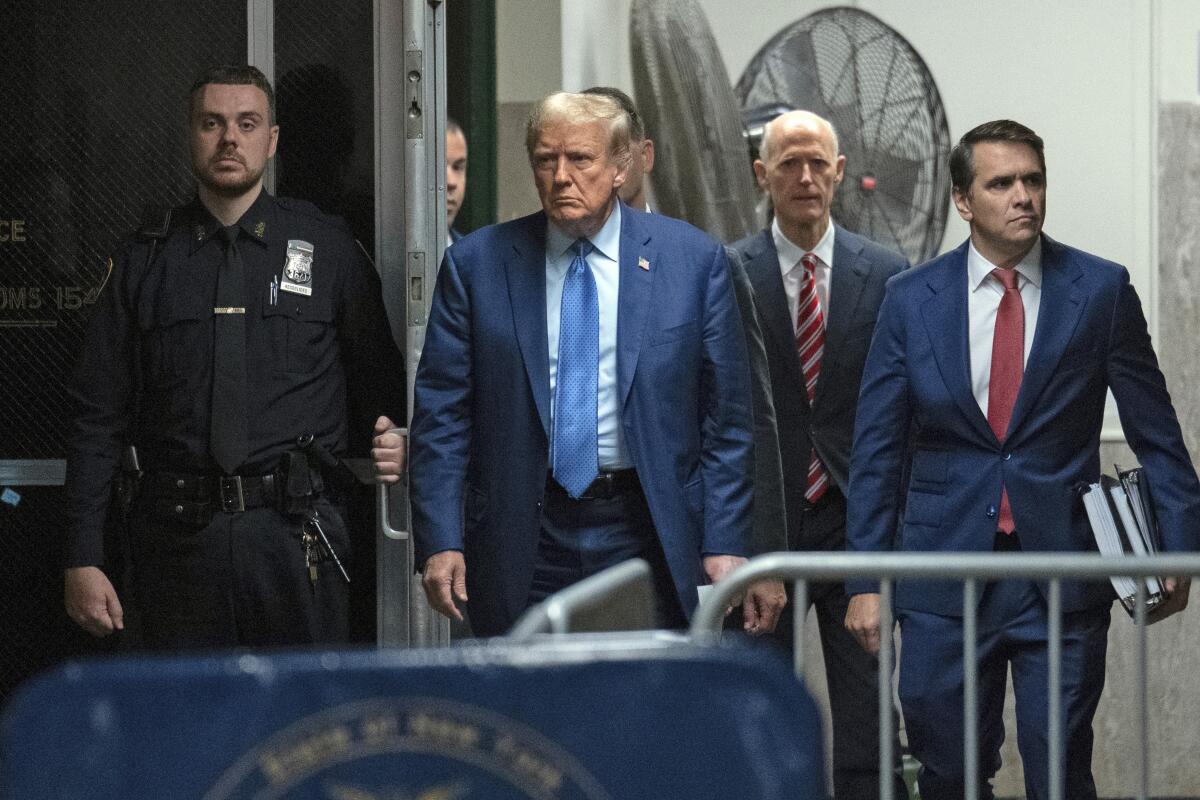 Former President Trump arrives at a courthouse.
