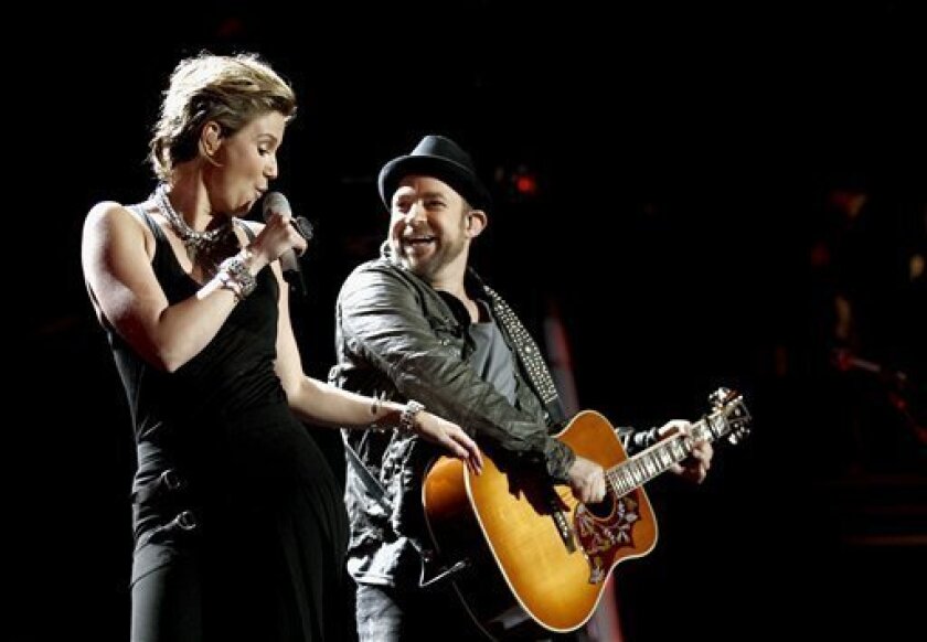 Sugarland will perform July 23 at UCSD RIMAC Field. The group's Jennifer Nettles, left, and Kristian Bush are shown here in their Dec. 3 San Diego performance at the "VH1 Divas Salute the Troops" TV concert. (AP Photo/Matt Sayles)