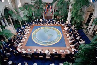 The leaders from 34 of the Western Hemisphere nation gather in Miami for the Summit of the Americas at Villa Vizcaya in Miami, Fla., Dec. 10, 1994. A map of the region dominates the table. U.S. President Bill Clinton and the other leaders sat down around the huge square table to work toward a plan to create a free-trade zone extending from Alaska to Argentina. (AP Photo/J. Scott Applewhite)