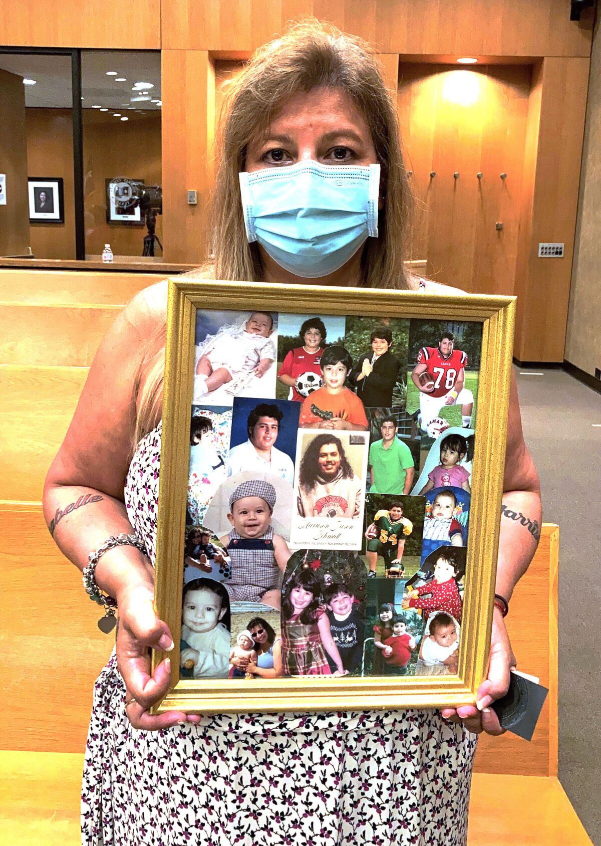 Angelica Halphen, whose 18-year-old son Harrison Schmidt was killed in a 2019 road rage shooting in Houston, Texas holds photos of her son in Houston, Wednesday Sept. 1, 2021. Texas' new law allowing most people to carry handguns in public without a license or training came in part from the belief by many here that the best way to prevent crime and stop an armed bad guy is to make sure an armed good guy is nearby. (AP Photo/Juan A. Lozano)
