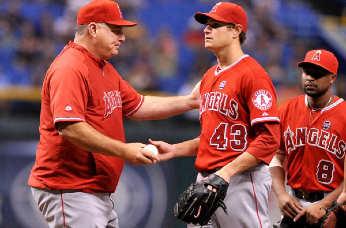 Manager Mike Scioscia says Garrett Richards (43) and other Angels starters won't be given a reduced workload the rest of the season. "We have to continue to play strong, play hard and play well," Scioscia says.