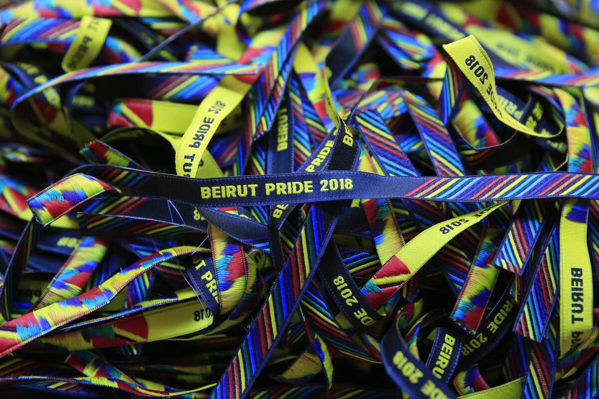FILE - Rainbow-colored bracelets are displayed at a restaurant during the launch event of Beirut Pride week, in Beirut, Lebanon, May 12, 2018. Rights groups in Lebanon have blasted the authorities of cracking down on activists and marginalized communities. Most recently, the Lebanese Interior Ministry in June 2022, called on security forces to shut down events promoting LGBTQ rights following complaints from religious officials. (AP Photo/Hassan Ammar, File)