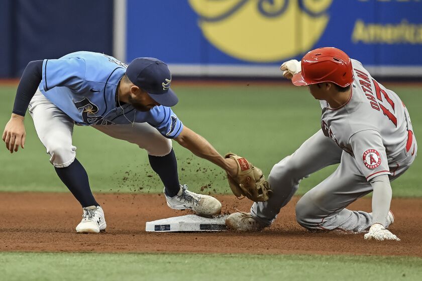 Los Angeles Angels' Shohei Ohtani (17) beats the tag from Tampa Bay Rays' Brandon Lowe.