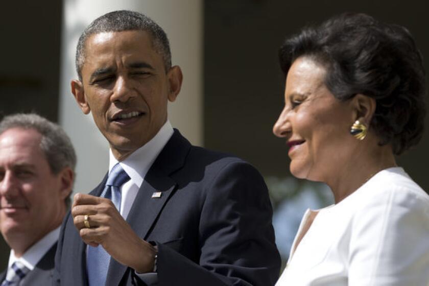 President Obama looks to longtime fundraiser and philanthropist Penny Pritzker in the Rose Garden of the White House.