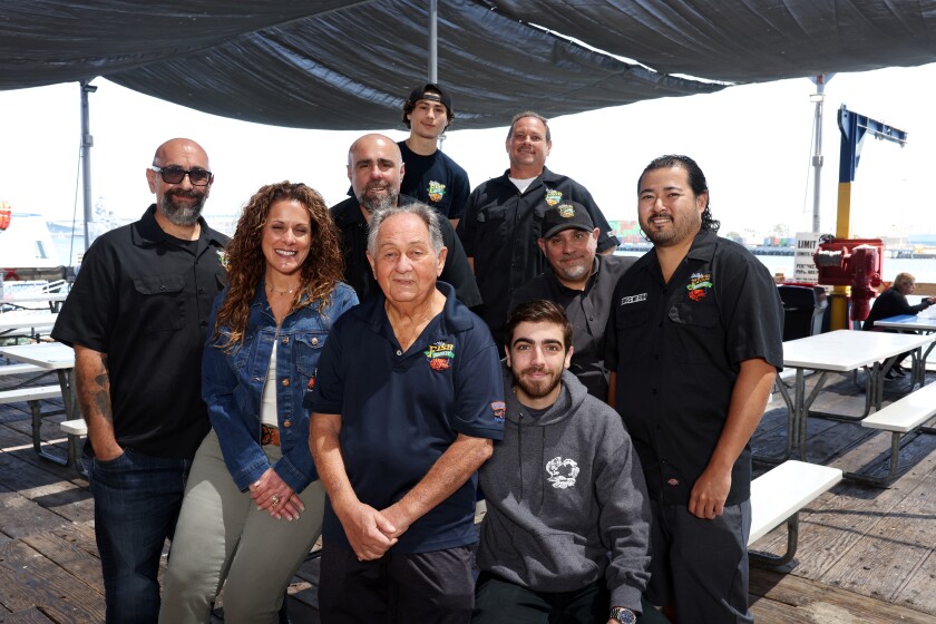 The Ungaro and Amalfitano families pose for a portrait at the San Pedro Fish Market