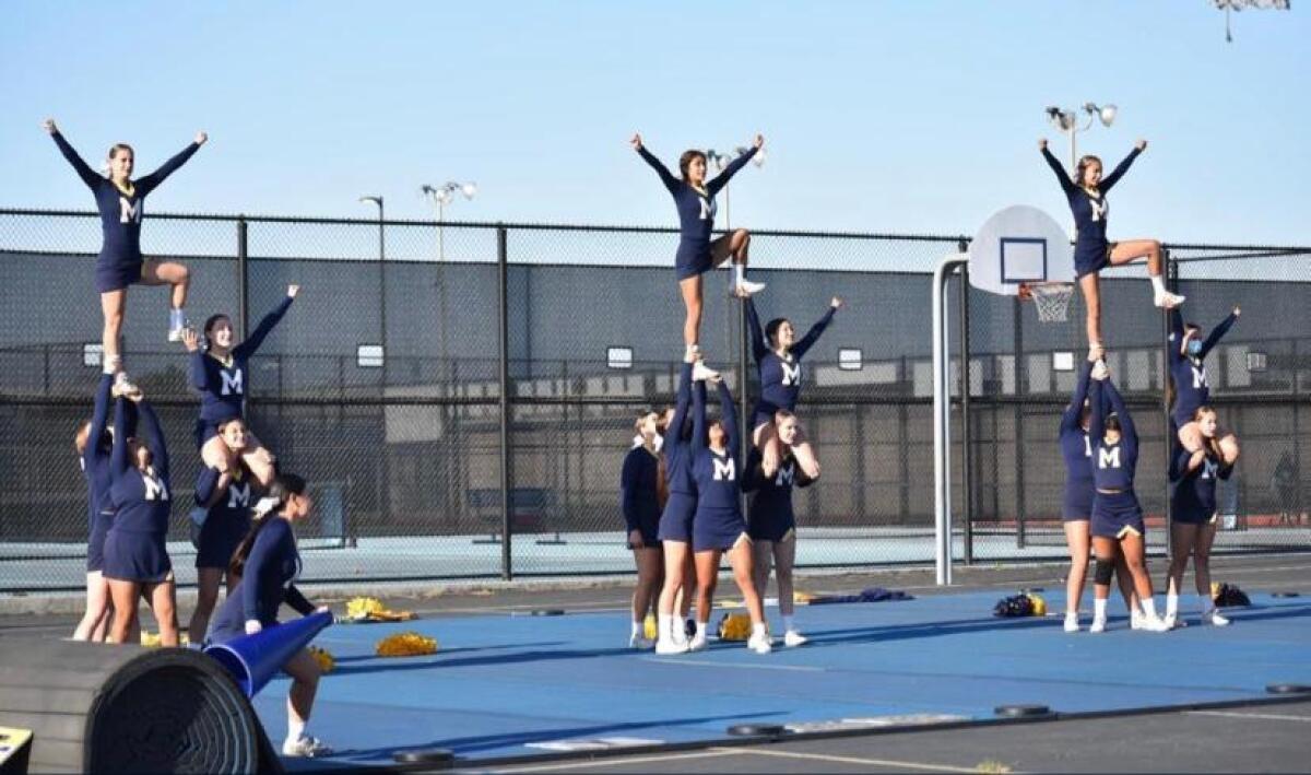 Marina High School cheerleaders practice a routine.