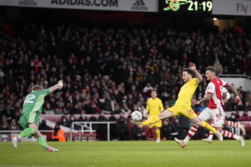 Liverpool's Diogo Jota scores his side's second goal during the English League Cup semifinal second leg soccer match between Arsenal and Liverpool at the Emirates Stadium in London, Thursday, Jan. 20, 2022. (AP Photo/Matt Dunham)