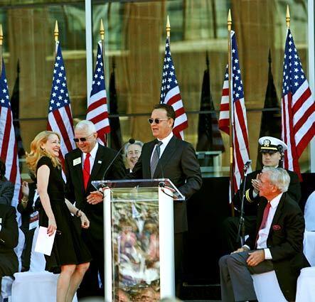 Actress Patricia Clarkson, left, shares a laugh with actor Tom Hanks, center, at the grand opening. Hanks was the executive producer of the museum's 35-minute movie, "Beyond All Boundaries," also starring Clarkson, Kevin Bacon, Brad Pitt, John Goodman and Neil Patrick Harris, among others.
