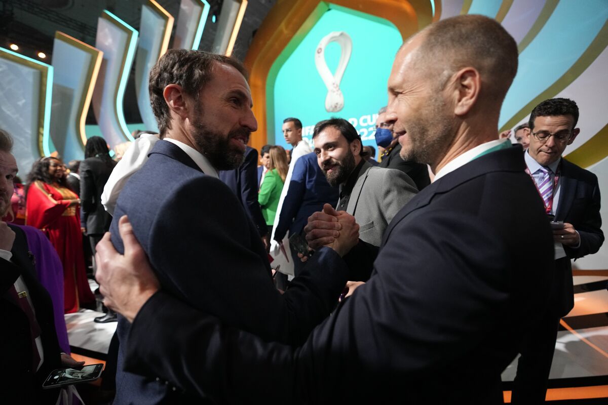 England manager Gareth Southgate, left, talks to United States counterpart Gregg Berhalter after the 2022 World Cup draw.