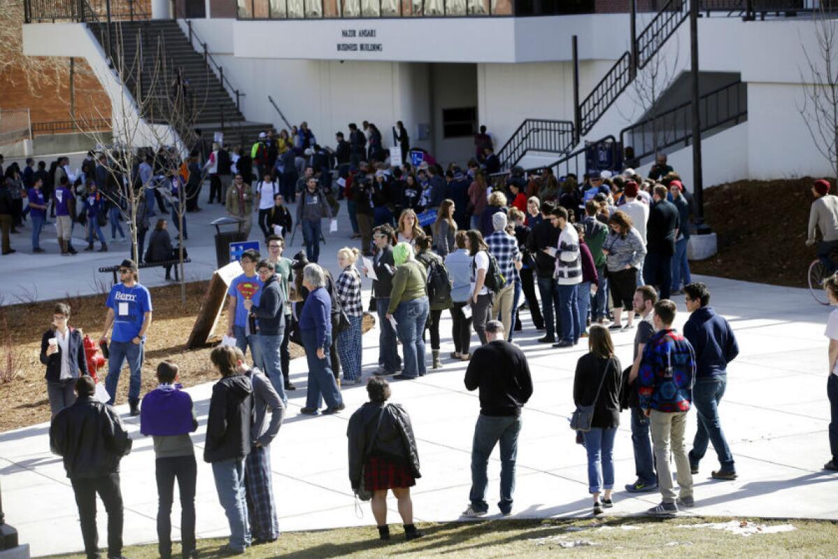 People line up to participate in the Democratic caucus at the University of Nevada in Reno in 2016.