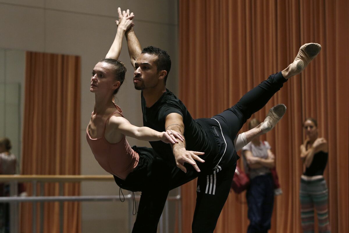 Adrian Blake Mitchell and Andrea Lassakova rehearse at the Renée and Henry Segerstrom Concert Hall.