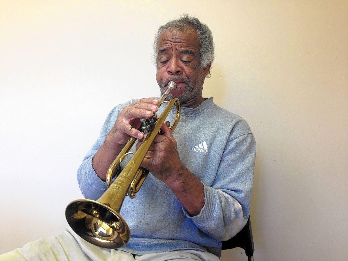 Nathaniel Ayers tests a new trumpet at a rehab center in Long Beach. “I’ve got my problems, but I wanna be free,” he says.