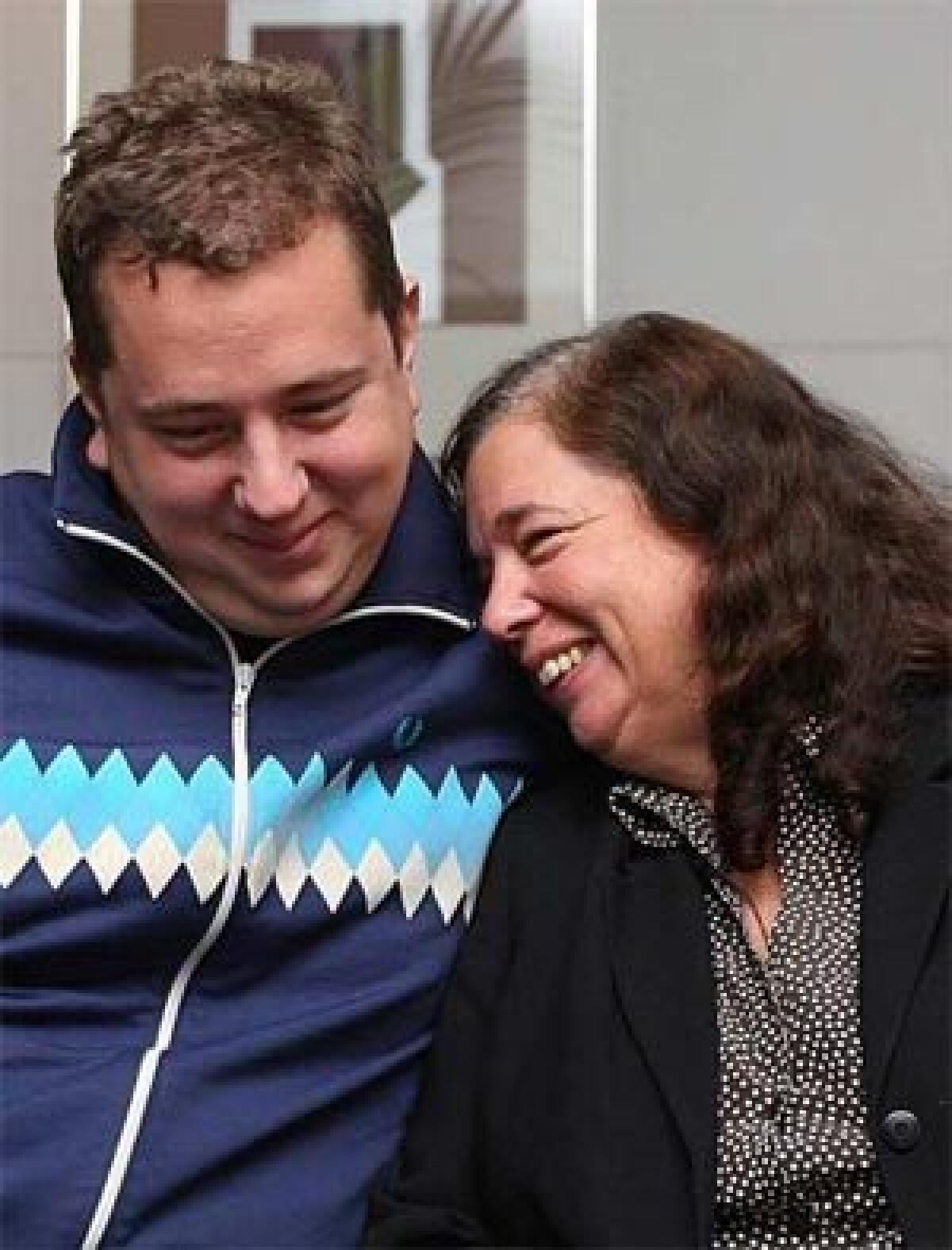 HAPPY MOMENT: Gillian Gibbons with her son John at Londons Heathrow Airport. I would like you to know I was well-treated in prison and everybody was very kind to me, she told reporters