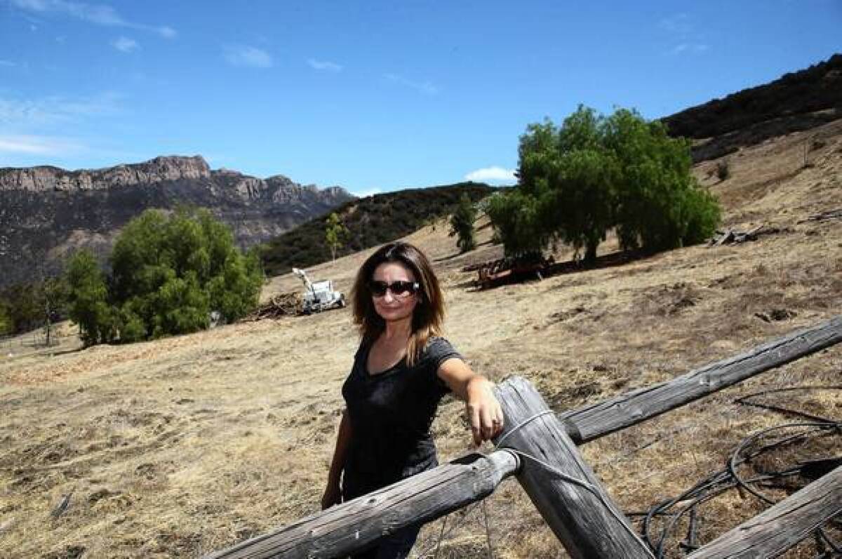 Irena Hauser stands on her Malibu property where the tigers' home would be built.