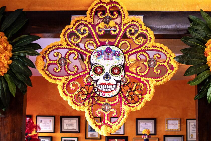 Dia de los Muertos Medallion, by local artist Luis Villanueva, at La Casita Mexicana restaurant.