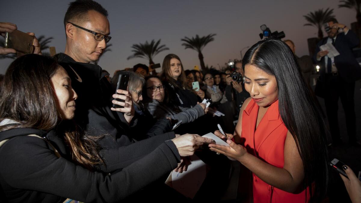 Yalitza Aparicio signs autographs for fans at the Palm International Film Festival.