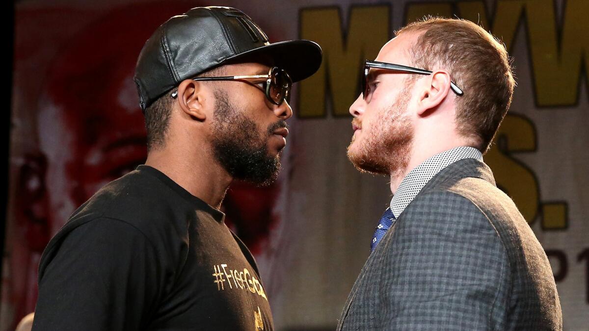 Badou Jack, left, and George Groves face off on Aug. 6 during a news conference to promote their fight on Saturday in Las Vegas.