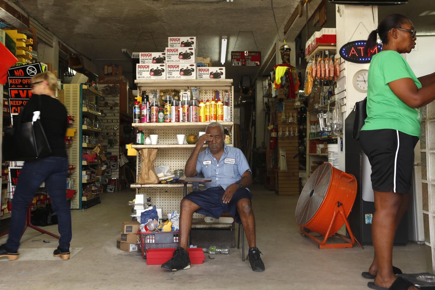 At Little Haiti Hardware and Lumber in Miami, owner Jean Rameau is already exhausted by the rush of people coming for supplies Sept. 7, 2017.