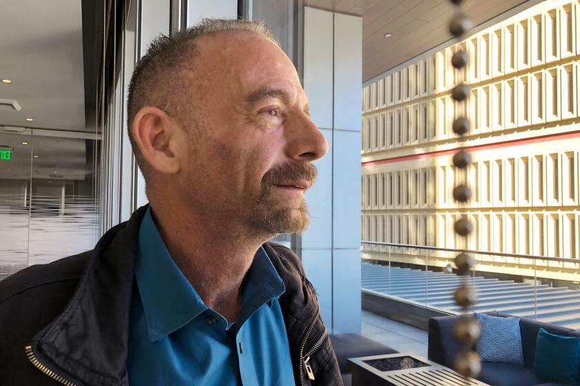 FILE - This March 4, 2019 file photo shows Timothy Ray Brown in Seattle. Brown, who made history as “the Berlin patient,” the first person known to be cured of HIV infection, died Tuesday, Sept. 29, 2020, at his home in Palm Springs, Calif., according to a social media post by his partner, Tim Hoeffgen. He was 54. The cause was a return of the cancer that originally prompted the unusual bone marrow and stem cell transplants Brown received in 2007 and 2008, which for years seemed to have eliminated both his leukemia and HIV, the virus that causes AIDS. (AP Photo/Manuel Valdes, File)