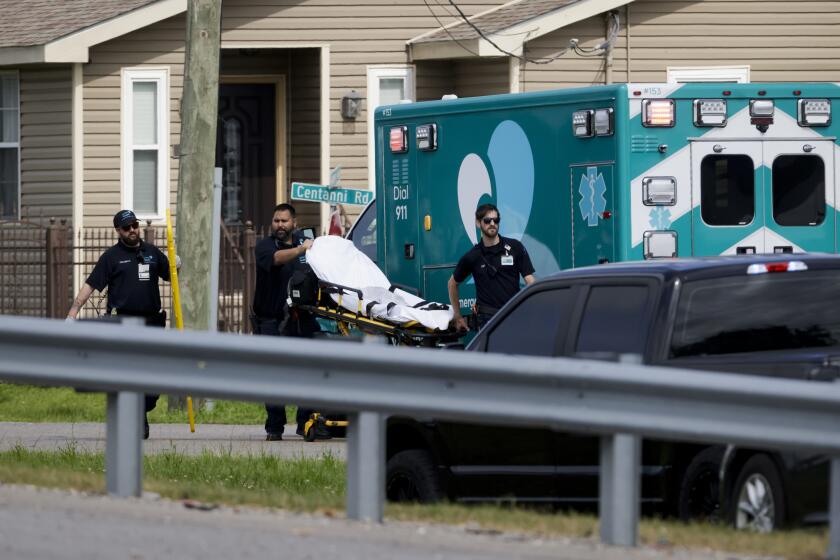 First responders work the scene after three Louisiana police officers were shot in a standoff Sunday, April 28, 2024, in Kenner, La. (Scott Threlkeld/The Times-Picayune/The New Orleans Advocate via AP)