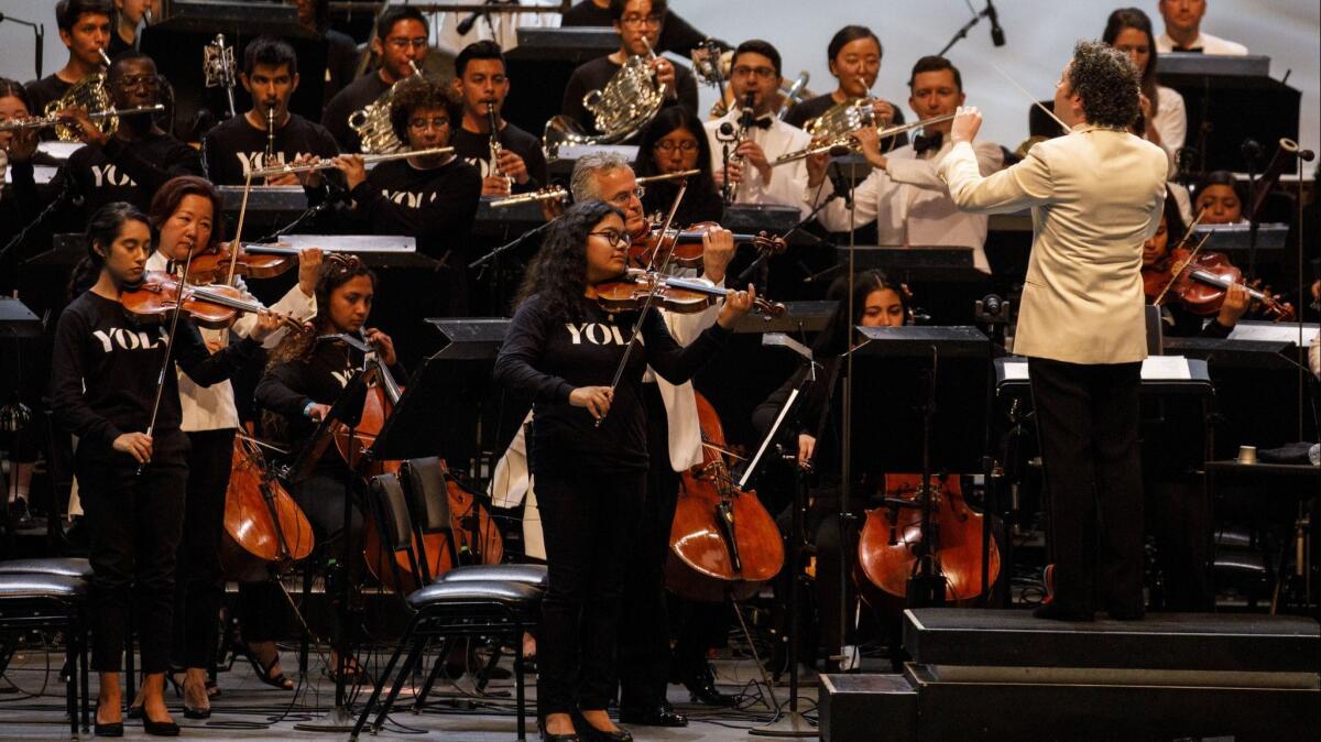 Gustavo Dudamel conducts the Youth Orchestra Los Angeles during the Los Angeles Philharmonic's 100th anniversary concert at the Hollywood Bowl on Sept. 30, 2018.