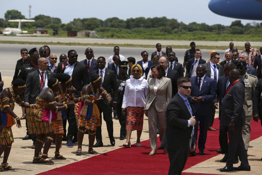 U.S. Vice President Kamala Harris is greeted by traditional dancers as she arrives in Accra, Ghana, Sunday March 26, 2023. Harris is on a seven-day African visit that will also take her to Tanzania and Zambia. (AP Photo/Misper Apawu)