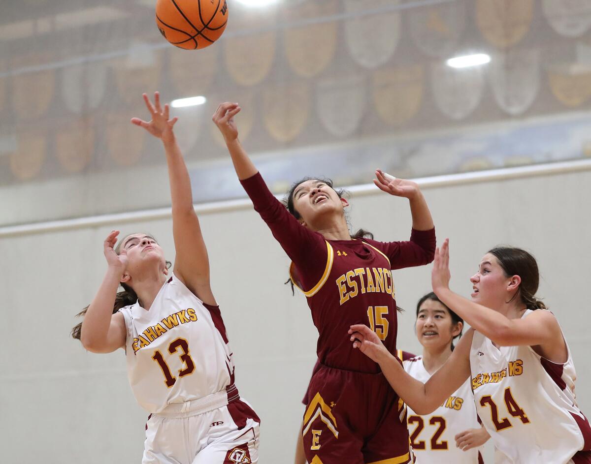 Ocean View's Angelina Bado (15) battles Estancia's Sofia Sihabouj (15) for a loose ball on Wednesday.