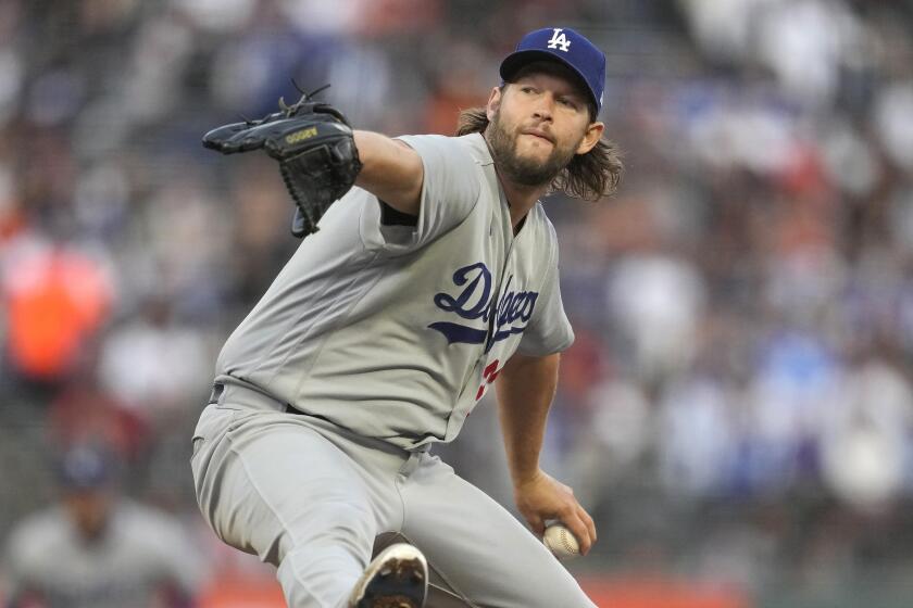 Los Angeles Dodgers pitcher Clayton Kershaw works against the San Francisco Giants on Sept. 30, 2023.