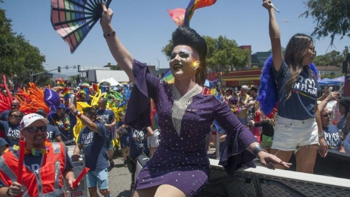 Revelers enjoy the 49th L.A. Pride parade in West Hollywood.