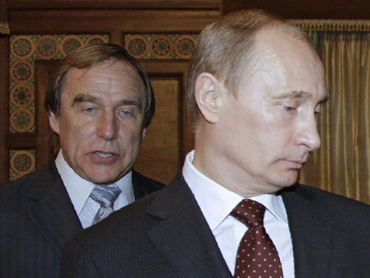 A 2009 photograph shows Russian cellist Sergei Roldugin, left, and his close friend Russian President Vladimir Putin.