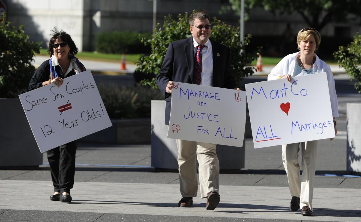 Supporters of gay marriage arrive outside the Pennsylvania Judicial Center in Harrisburg before a hearing concerning Montgomery County clerk D. Bruce Hanes, who has been issuing marriage licenses to same-sex couples. The state Health Department filed suit against Hanes to stop the practice.