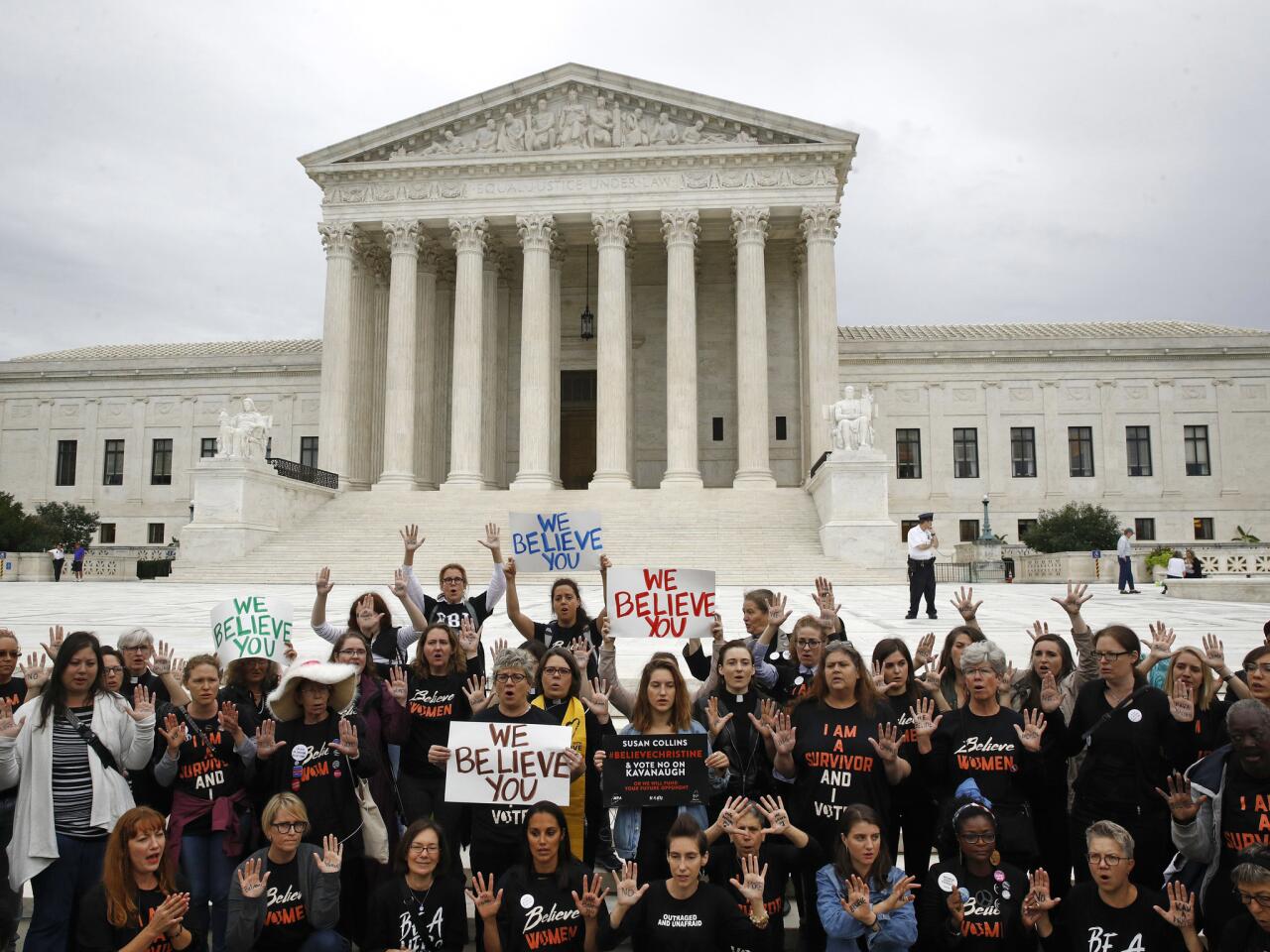 Protesters gather in front of the Supreme Court on Capitol Hill in Washington.