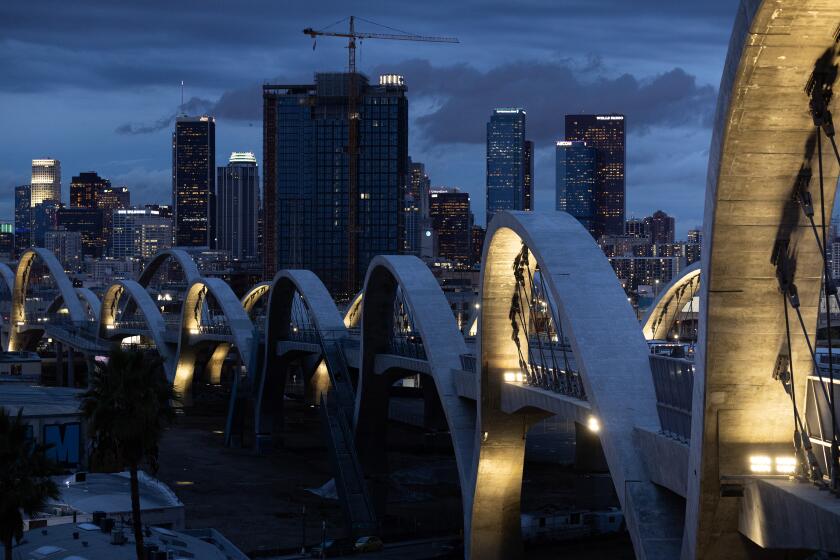 Los Angeles, CA - December 21:Two arches are dark on the 6th Street Bridge because of copper wire thieves on Thursday, Dec. 21, 2023 in Los Angeles, CA.(Brian van der Brug / Los Angeles Times)